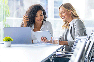 two-women-reviewing-work