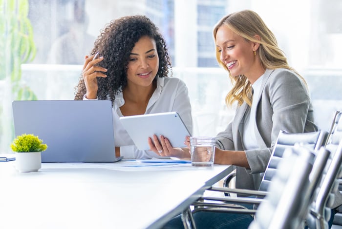two-women-reviewing-work
