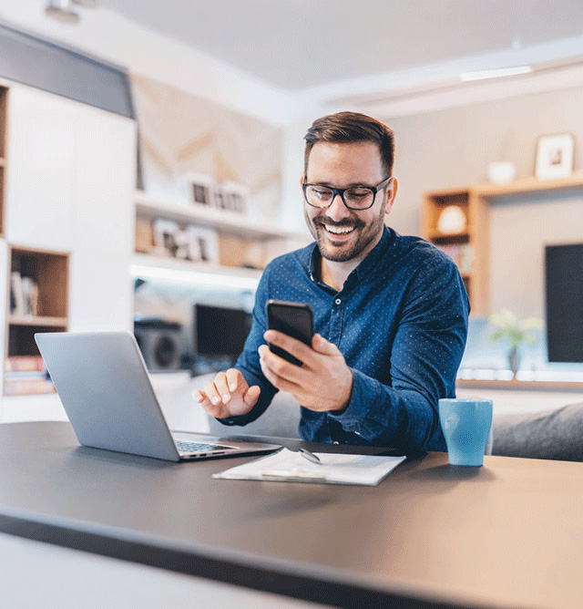 man-smiling-at-phone